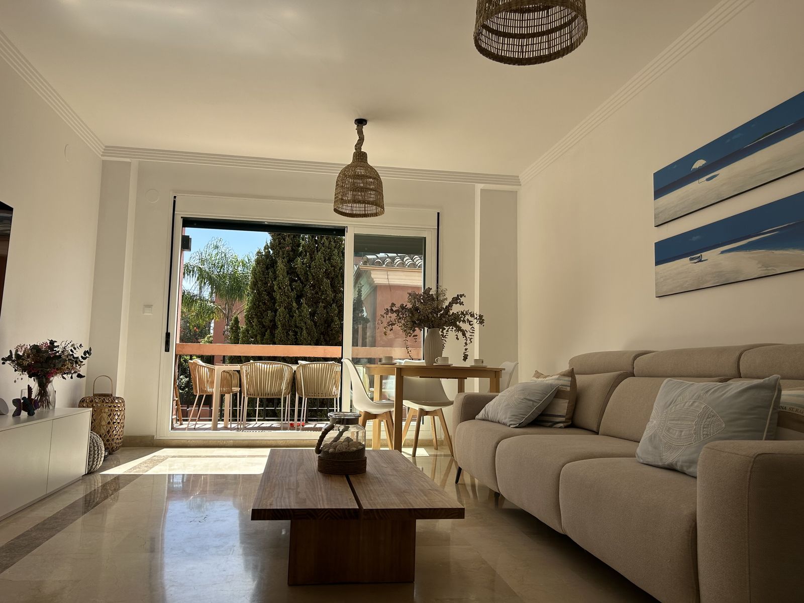 Bright living room opening onto the private terrace of the Marbella apartment